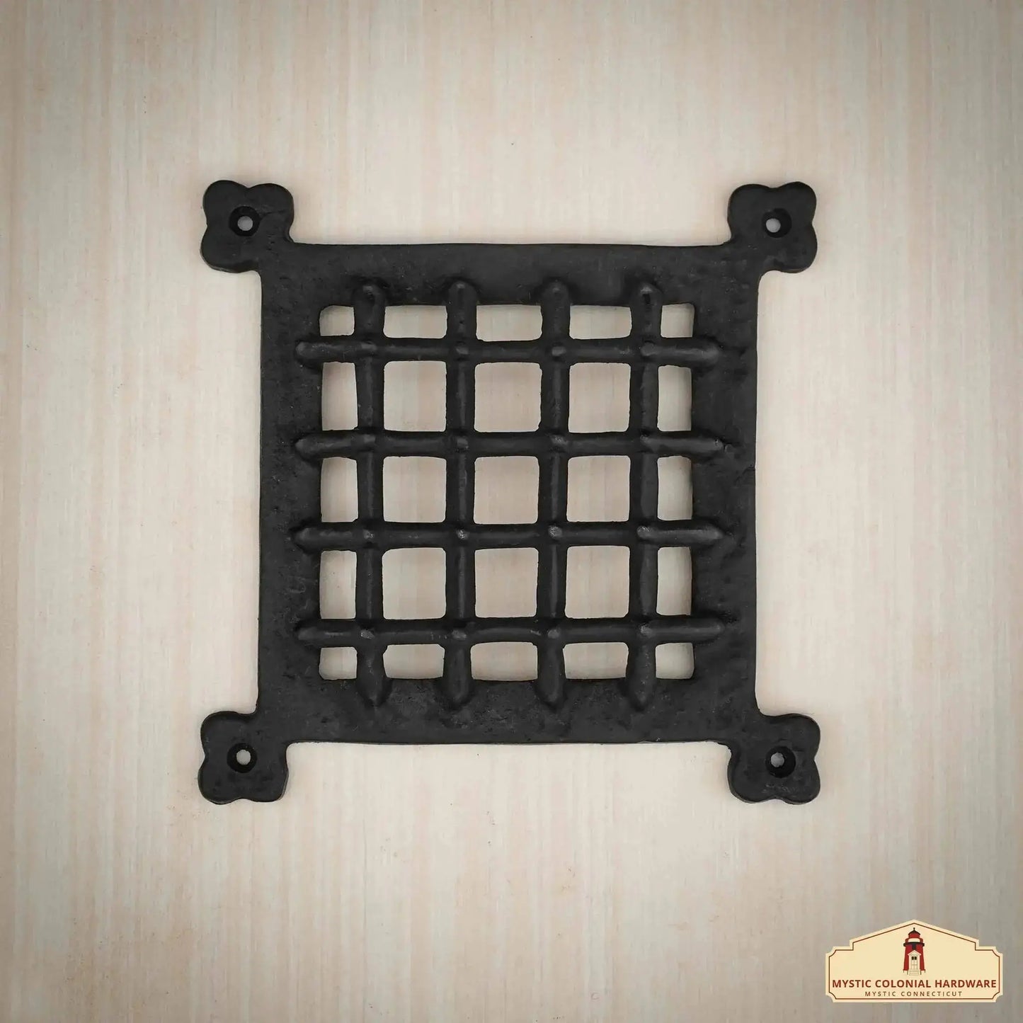 Medieval Cast Iron Door Grill mounted on a wooden surface, showcasing its antique-style craftsmanship, perfect for rustic homes, sheds, or castle doors.