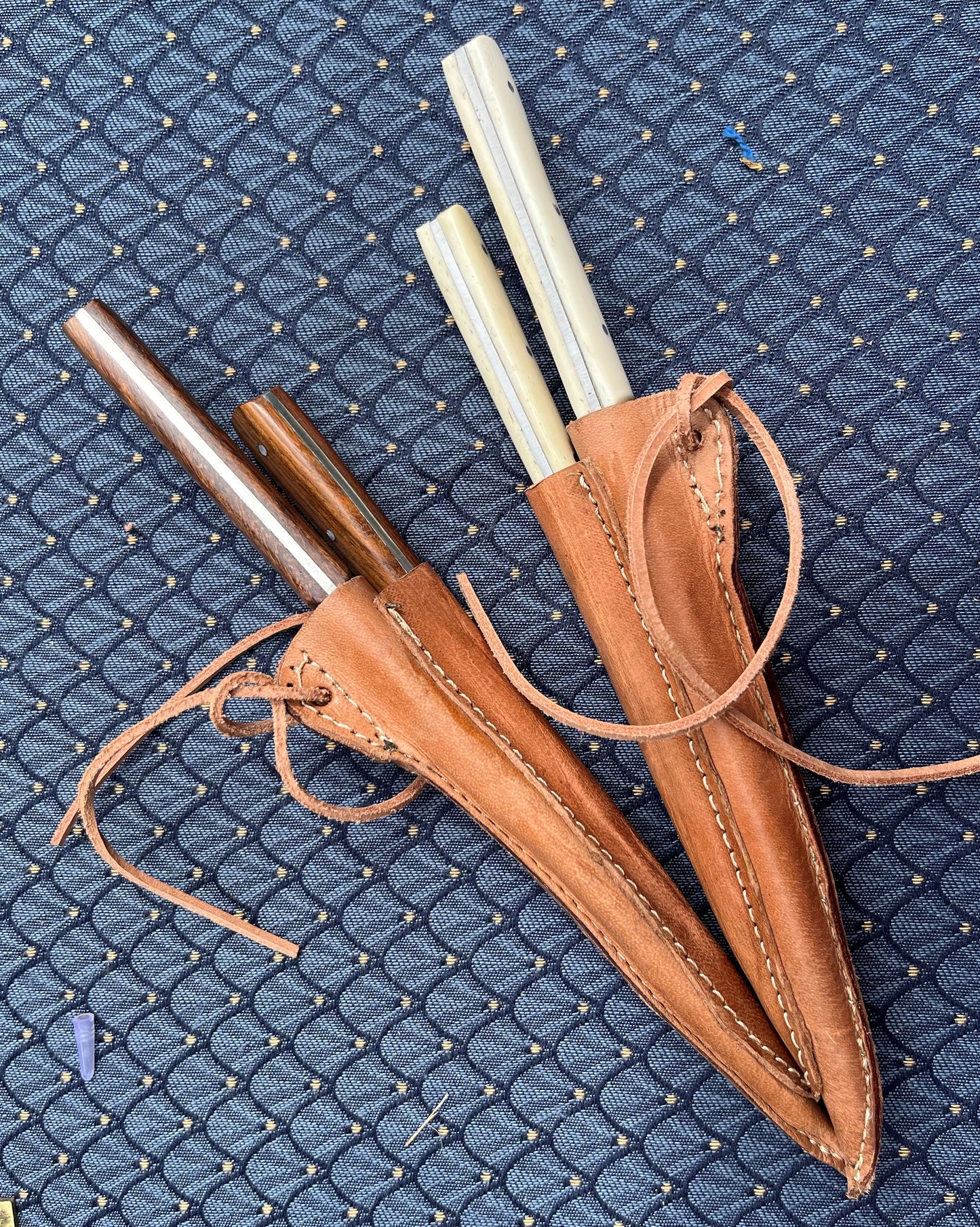 Two medieval cutlery sets with bone and wood handles, neatly stored in brown leather sheaths, ideal for LARP, reenactments, and historical feasts.