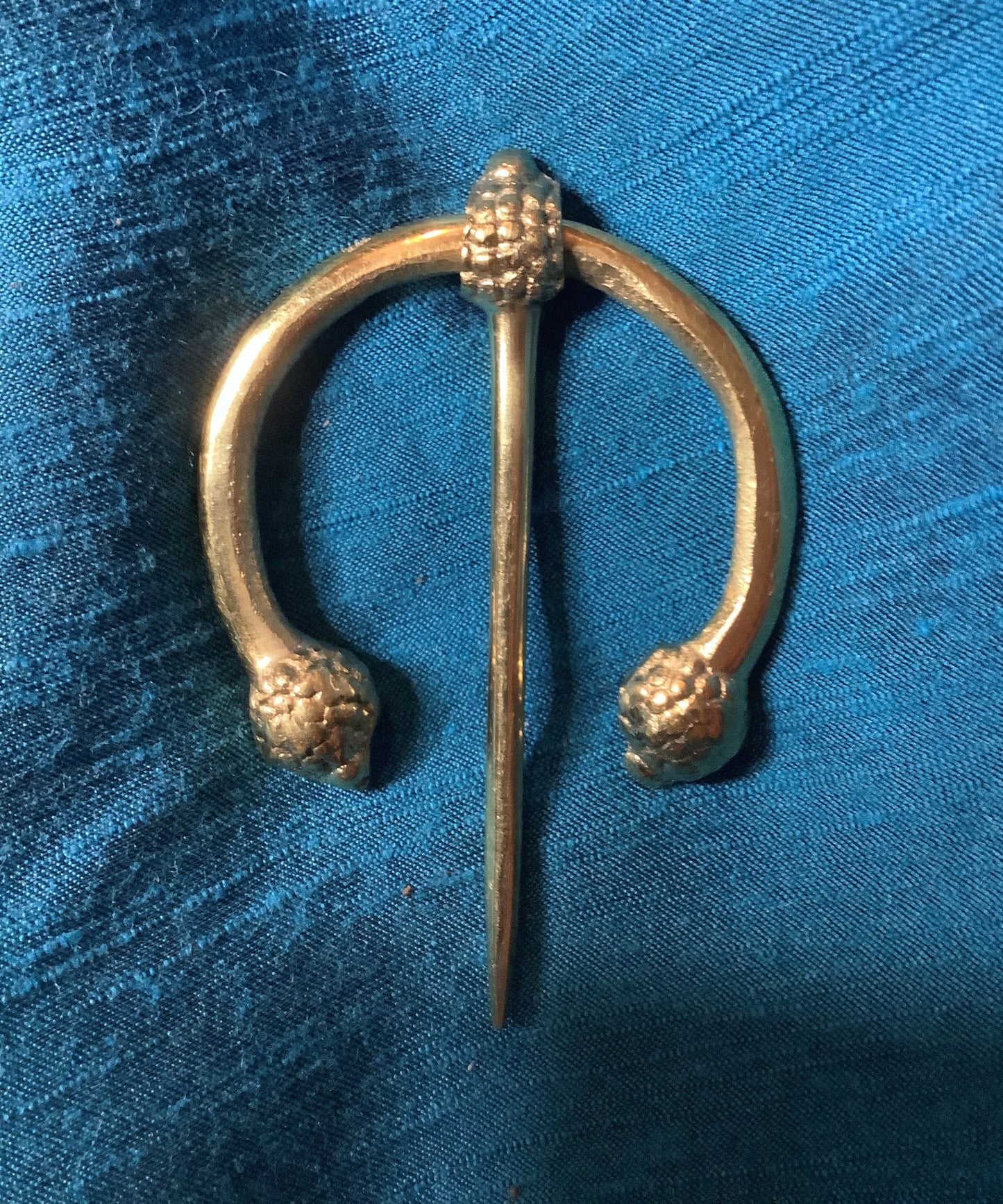 Penannular Brooch with Thistle Terminals